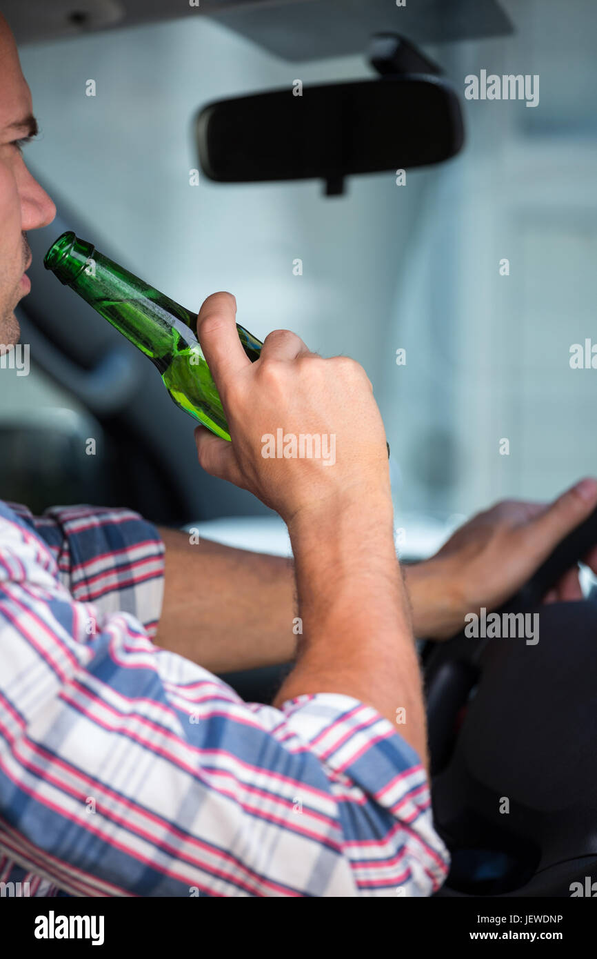 Man drinking beer while driving Stock Photo Alamy