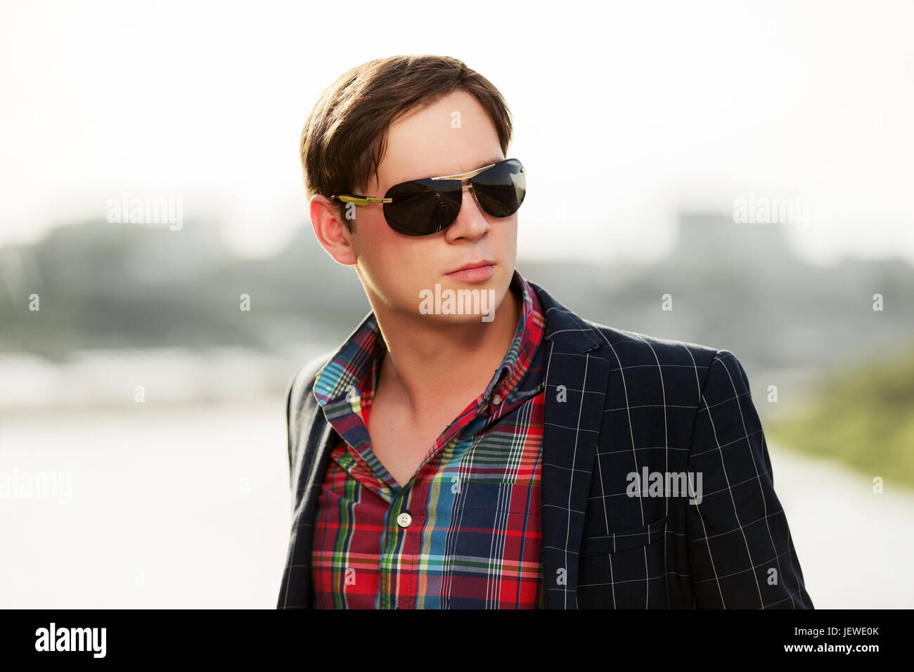Portrait of young fashion man in sunglasses outdoor Stock Photo