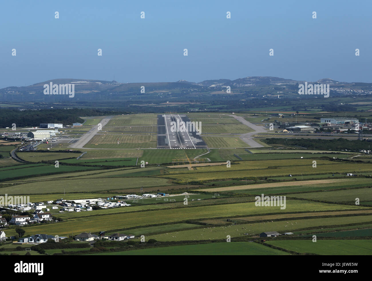 Looking towards Newquay Airport and its long runway whilst flying over the Cornish coast. Stock Photo