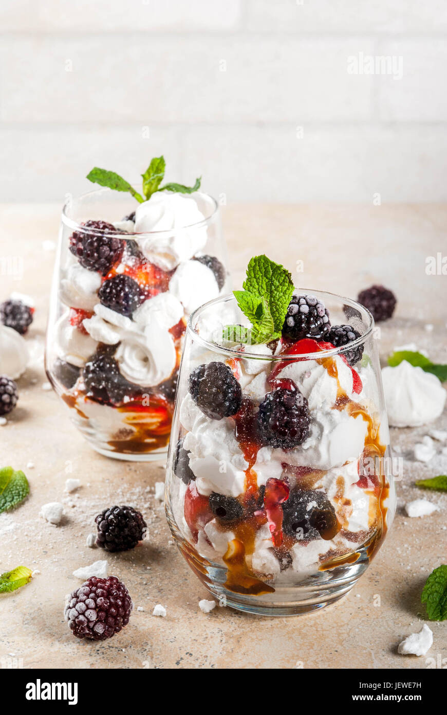 Traditional English dessert. Eton mess whipped cream, meringue, fresh blackberries, sauce and