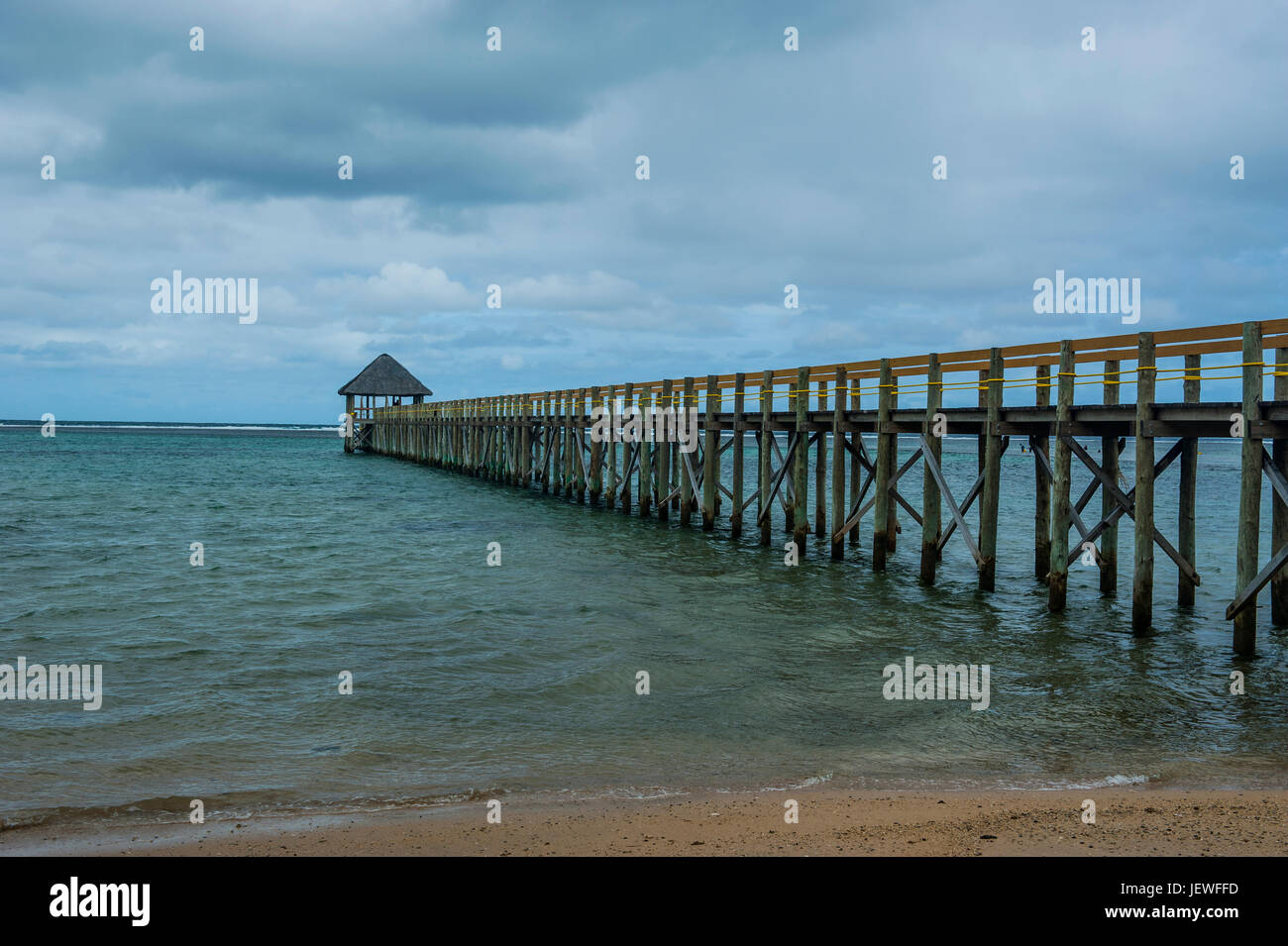 Long wooden pier, Coral Coast, Viti Levu, Fiji, South Pacific Stock Photo