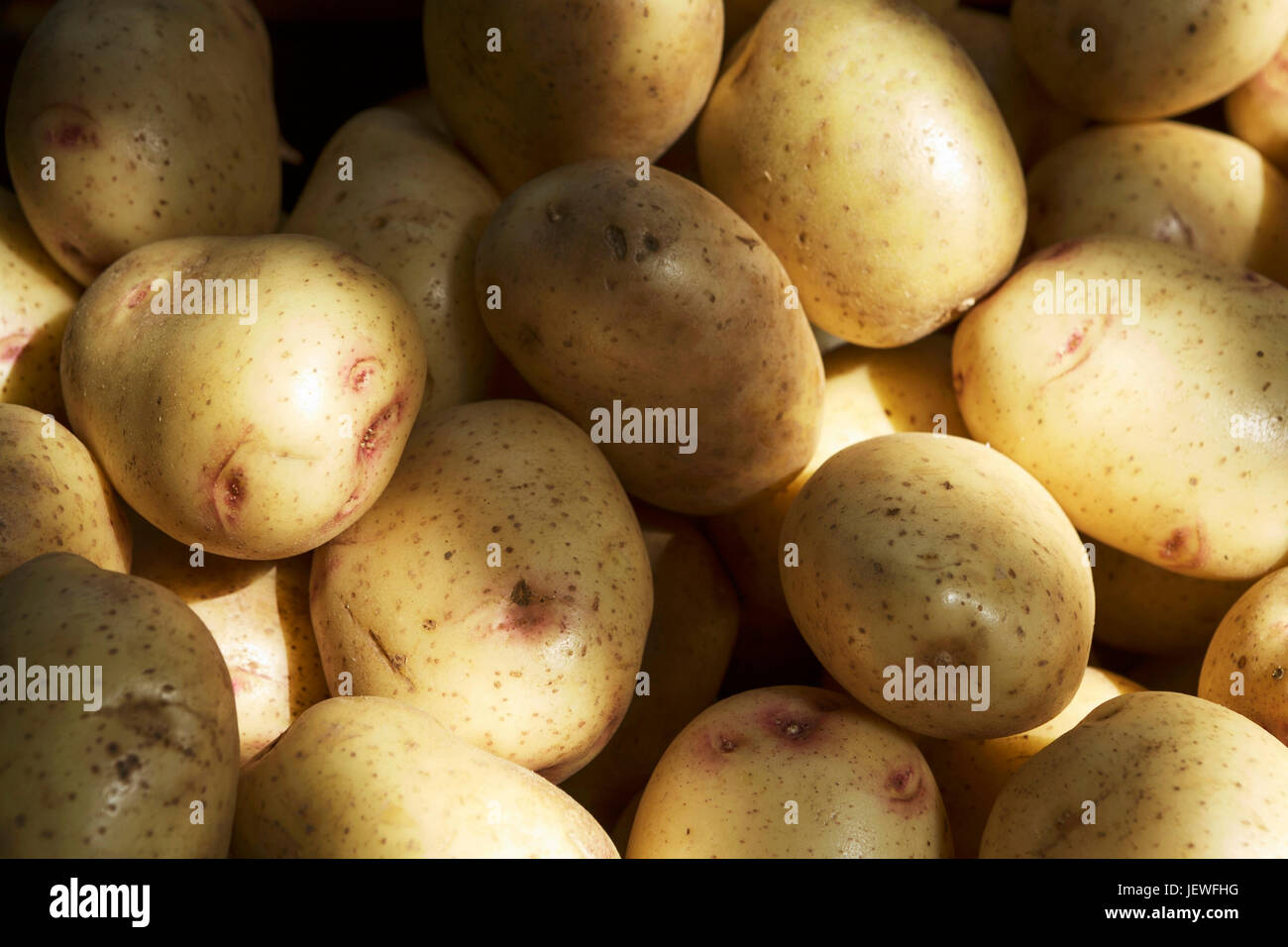 Spuds, jacket potatoes, staple foods, rising food prices. Inflation. Stock Photo