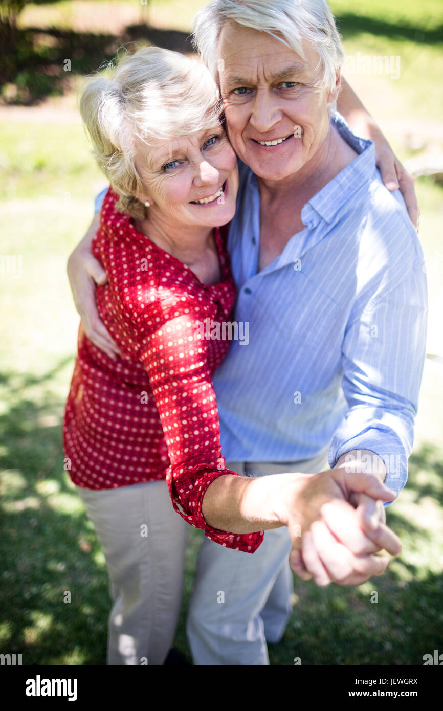 Happy senior couple dancing in the park Stock Photo - Alamy