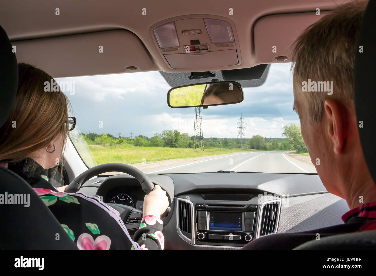 Girl behind steering wheel hi-res stock photography and images - Alamy