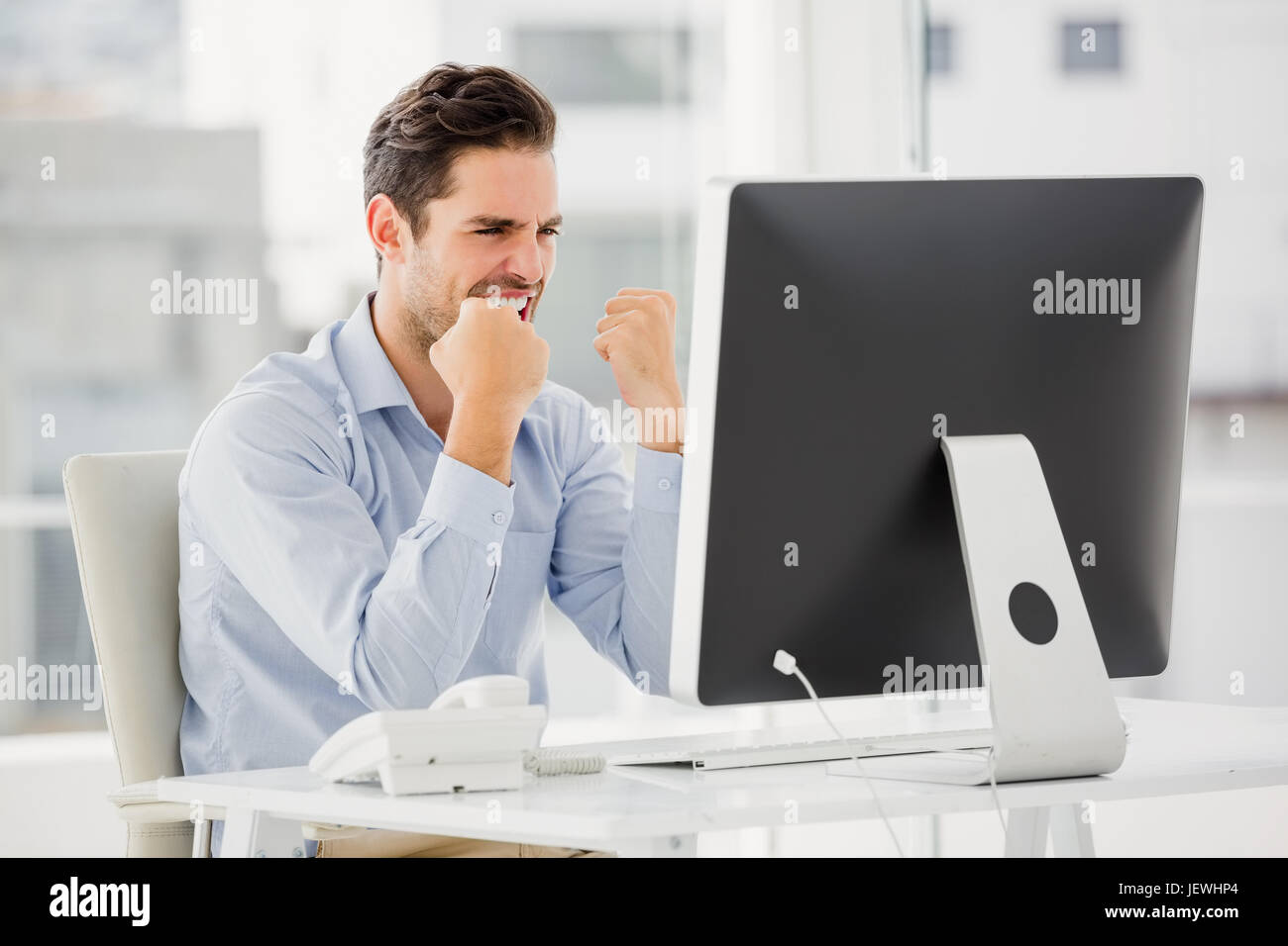Cheering businessman desk in hi-res stock photography and images - Alamy
