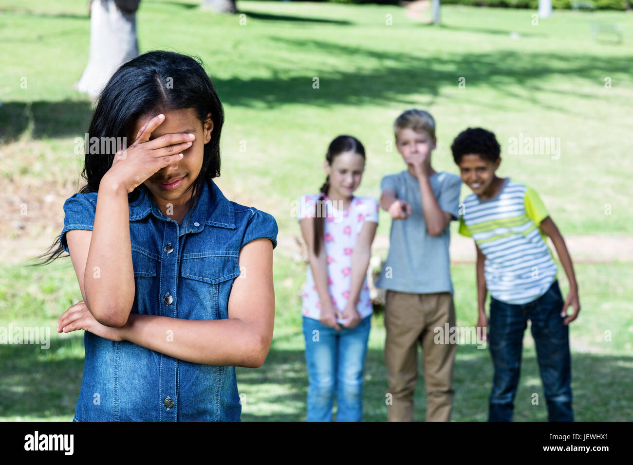 Friends teasing a girl Stock Photo Alamy