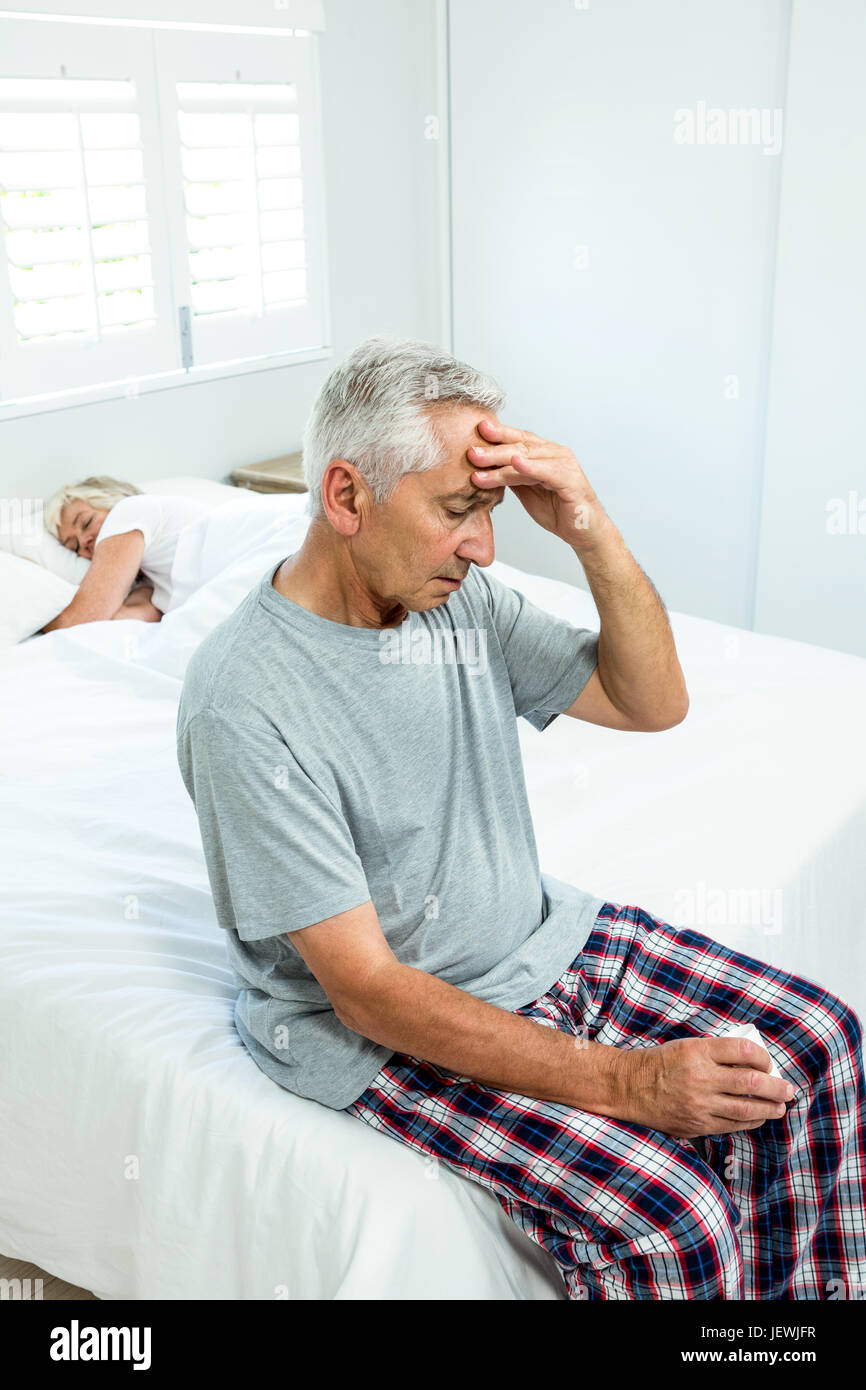 Senior man suffering from headache at home Stock Photo - Alamy