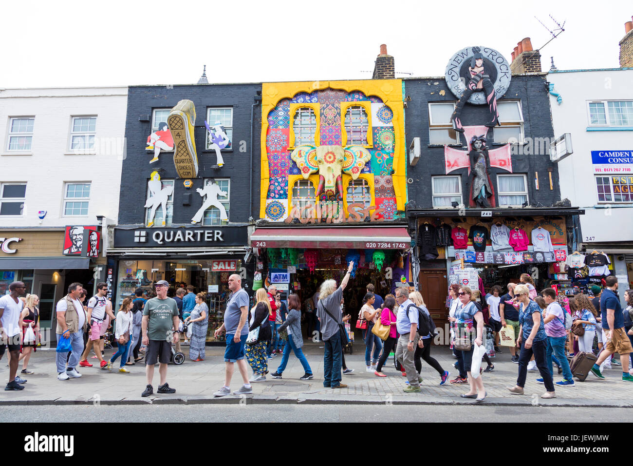Crowds and colourful arty shop fronts in Camden Market, London, UK Stock Photo