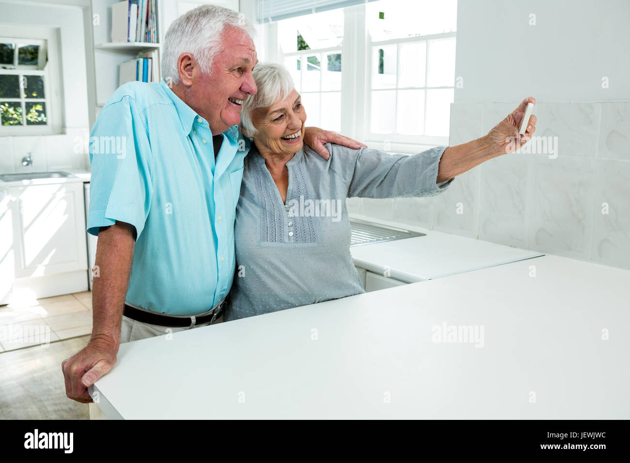 Happy senior couple taking selfie at home Stock Photo - Alamy