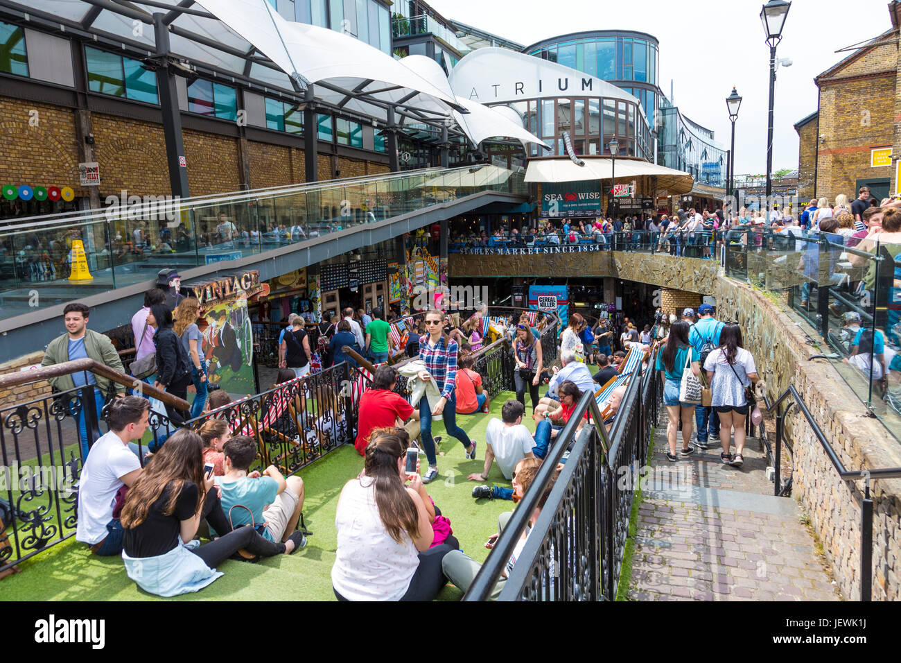 People enjoying the sun at Camden Sables Market in North London, UK Stock Photo