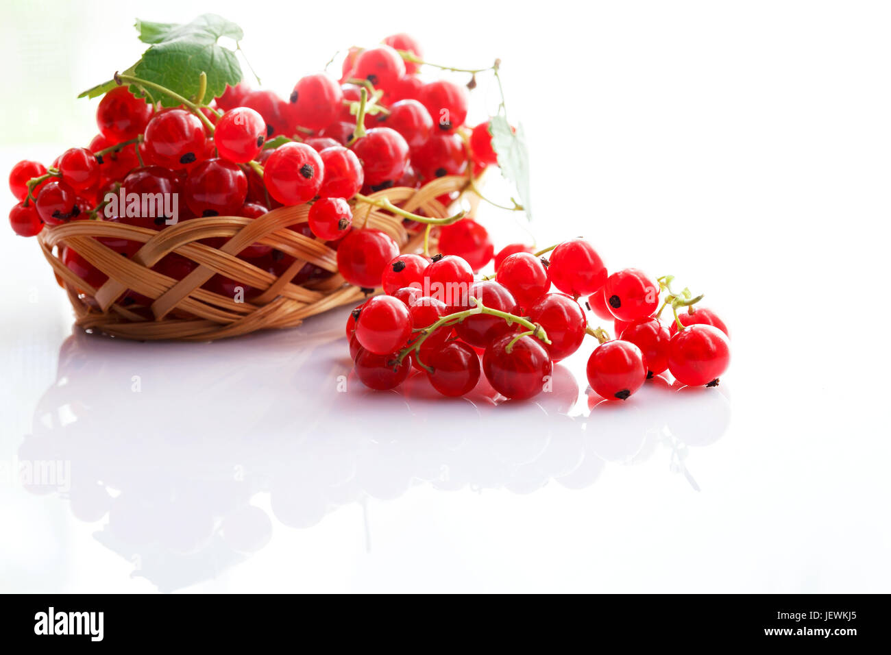 Fruits of red currants on a light background. Close-up Stock Photo