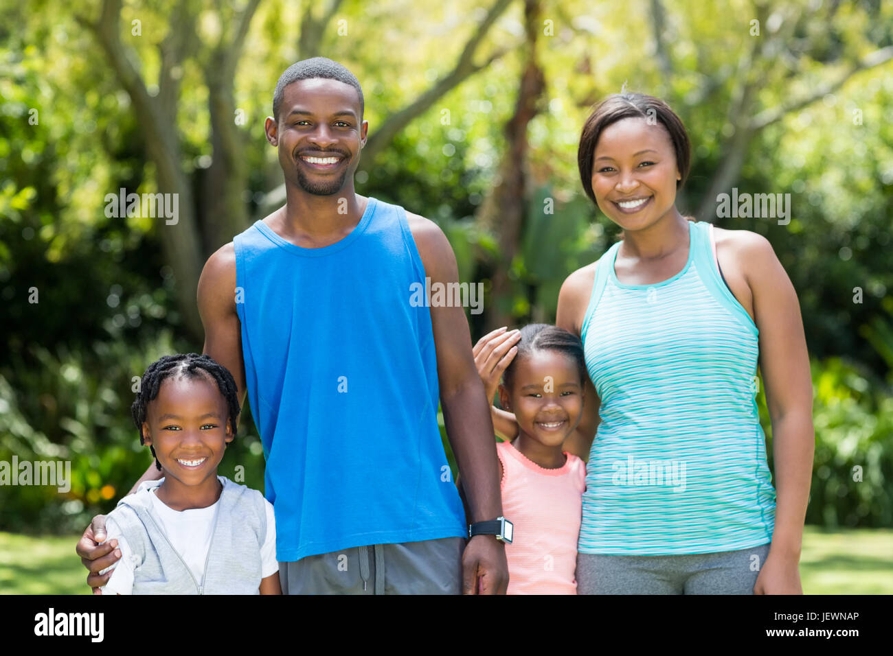 Happy family posing together Stock Photo - Alamy