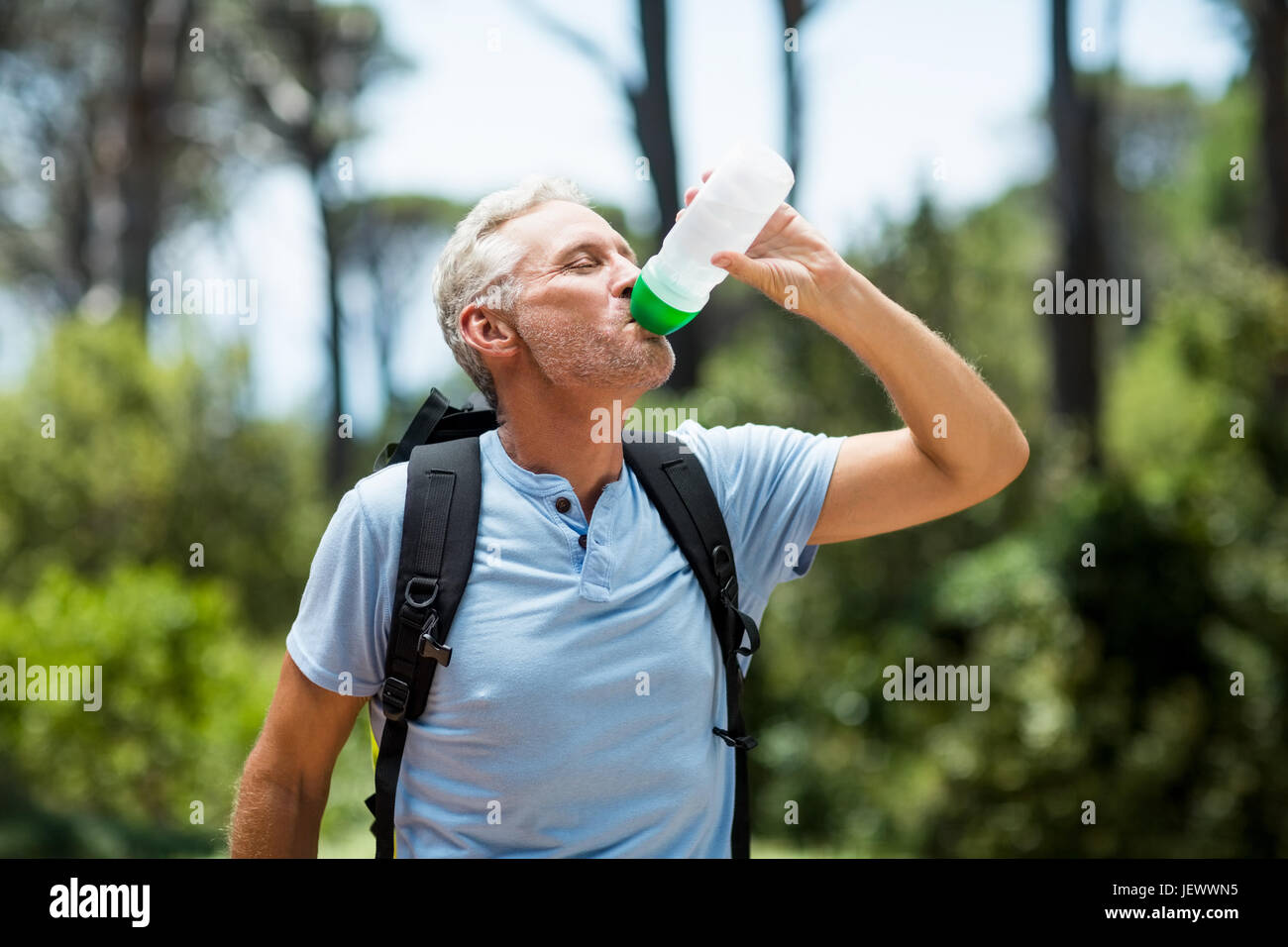 Man drinking with his flask Stock Photo Alamy