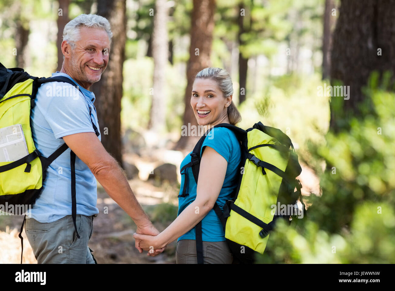 Couple smiling and holding hands each other Stock Photo - Alamy