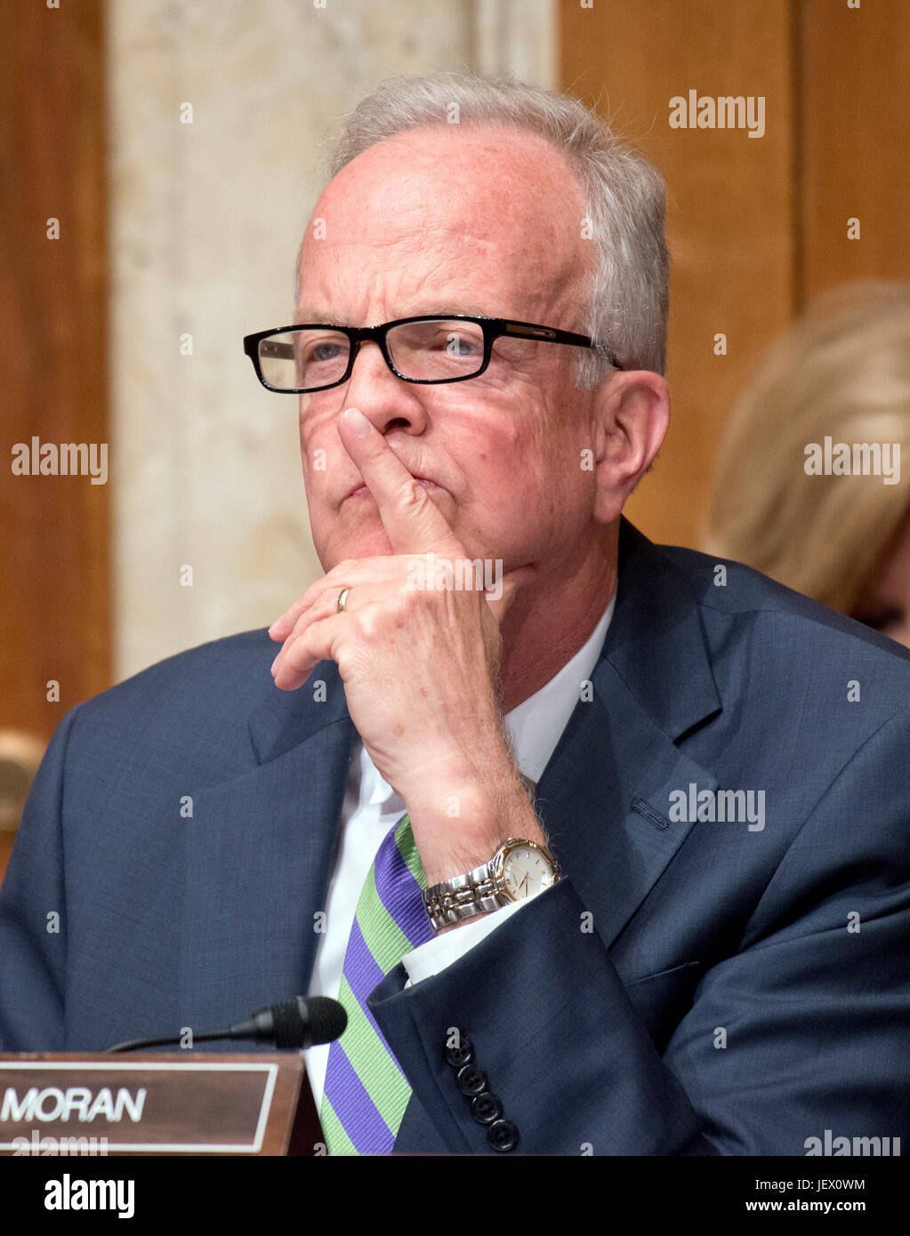 United States Senator Jerry Moran (Republican of Kansas) listens as Jay Clayton, Chairman, US