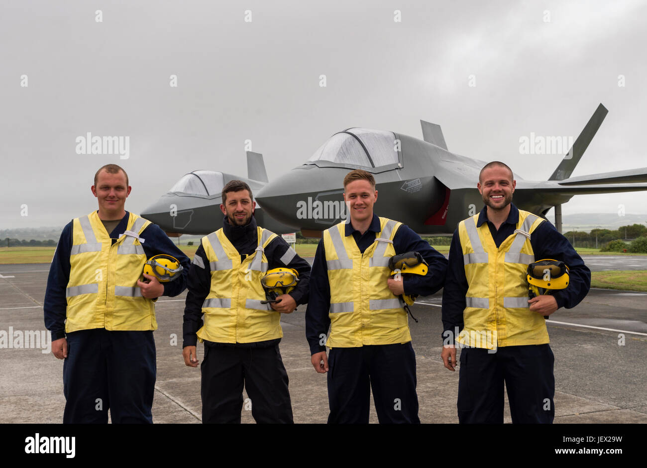 Official Media Assignment at RNAS Culdrose, Helston, Cornwall, UK. 27th June, 2017. Four Aircraft Handlers from RNAS Culdrose about to complete their training at RNAS Culdrose dummy deck facility prior to joining HMS Queen Elizabeth. Background four F35B replica jets Credit: Bob Sharples/Alamy Live News Stock Photo