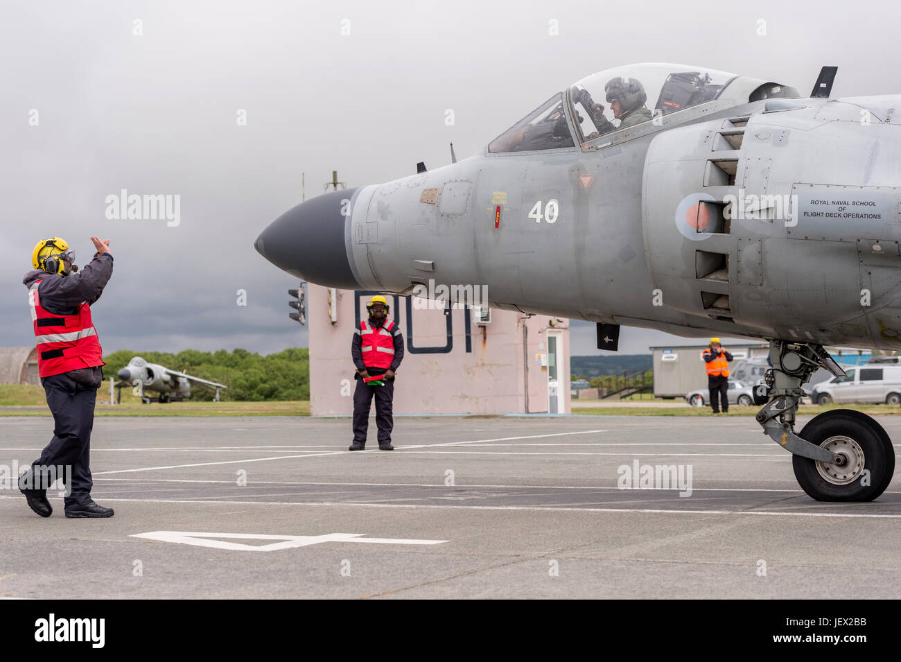 Official Media Assignment at RNAS Culdrose, Helston, Cornwall, UK. 27th June, 2017. Aircraft , Aircraft Handler instructors on the dummy deck facility marshall a Sea Harrier at RNAS Culdrose. The Sea Harriers are used to simulate 'live deck' conditions on aircraft carriers such as HMS Queen Elizabeth Credit: Bob Sharples/Alamy Live News Stock Photo
