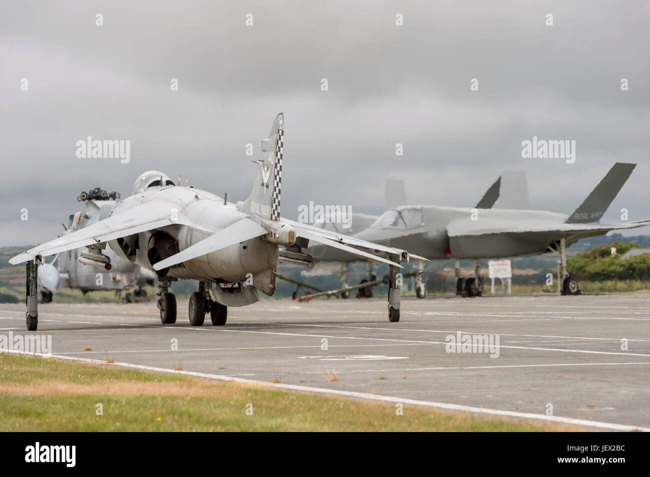 Official Media Assignment at RNAS Culdrose, Helston, Cornwall, UK. 27th June, 2017. Sea Harriers moves past the F35b replica aircraft. The Sea Harrier is used to simulate real flight deck conditions for the aircraft handlers that they would experience on HMS Queen Elizabeth Credit: Bob Sharples/Alamy Live News Stock Photo