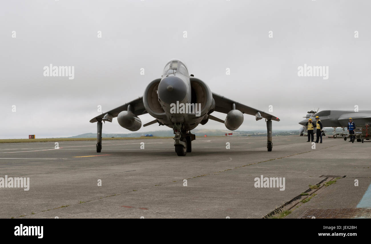 Official Media Assignment at RNAS Culdrose, Helston, Cornwall, UK. 27th June, 2017. Sea Harriers moves past the F35b replica aircraft. The Sea Harrier is used to simulate real flight deck conditions for the aircraft handlers Credit: Bob Sharples/Alamy Live News Stock Photo