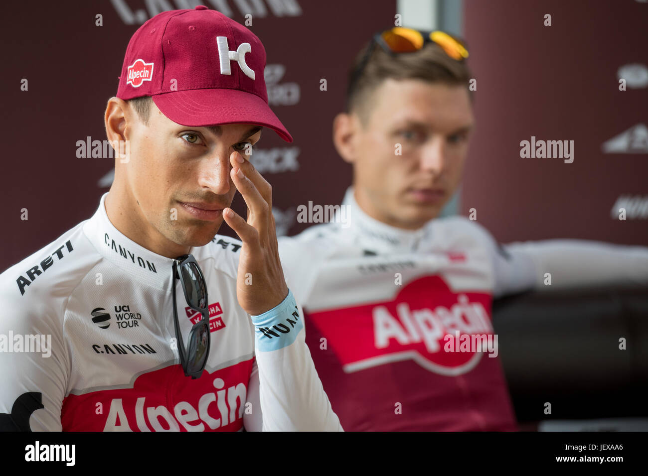 Duesseldorf, Germany. 28th June, 2017. Swiss cyclist Reto Hollenstein (L) and his German teammate Tony Martin (both Katusha Alpecin) at a press conference in Duesseldorf, Germany, 28 June 2017. Duesseldorf is the starting point of this year's Tour de France cycling competition which begins on the 1 July. Photo: Daniel Karmann/dpa/Alamy Live News Stock Photo