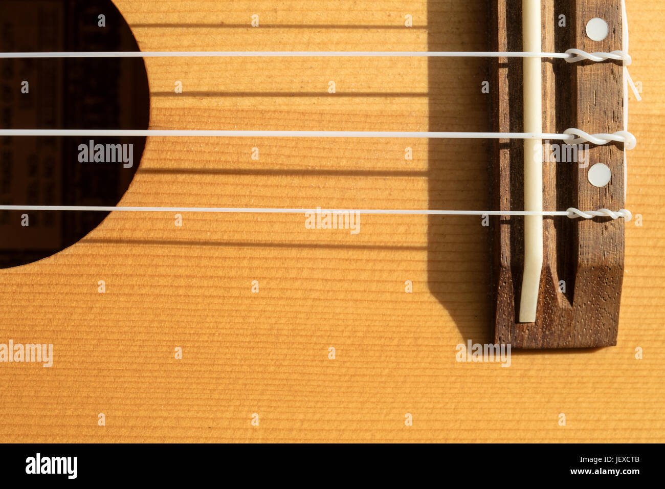 Detail of ukulele parts, such as bridge and sound hole Stock Photo Alamy