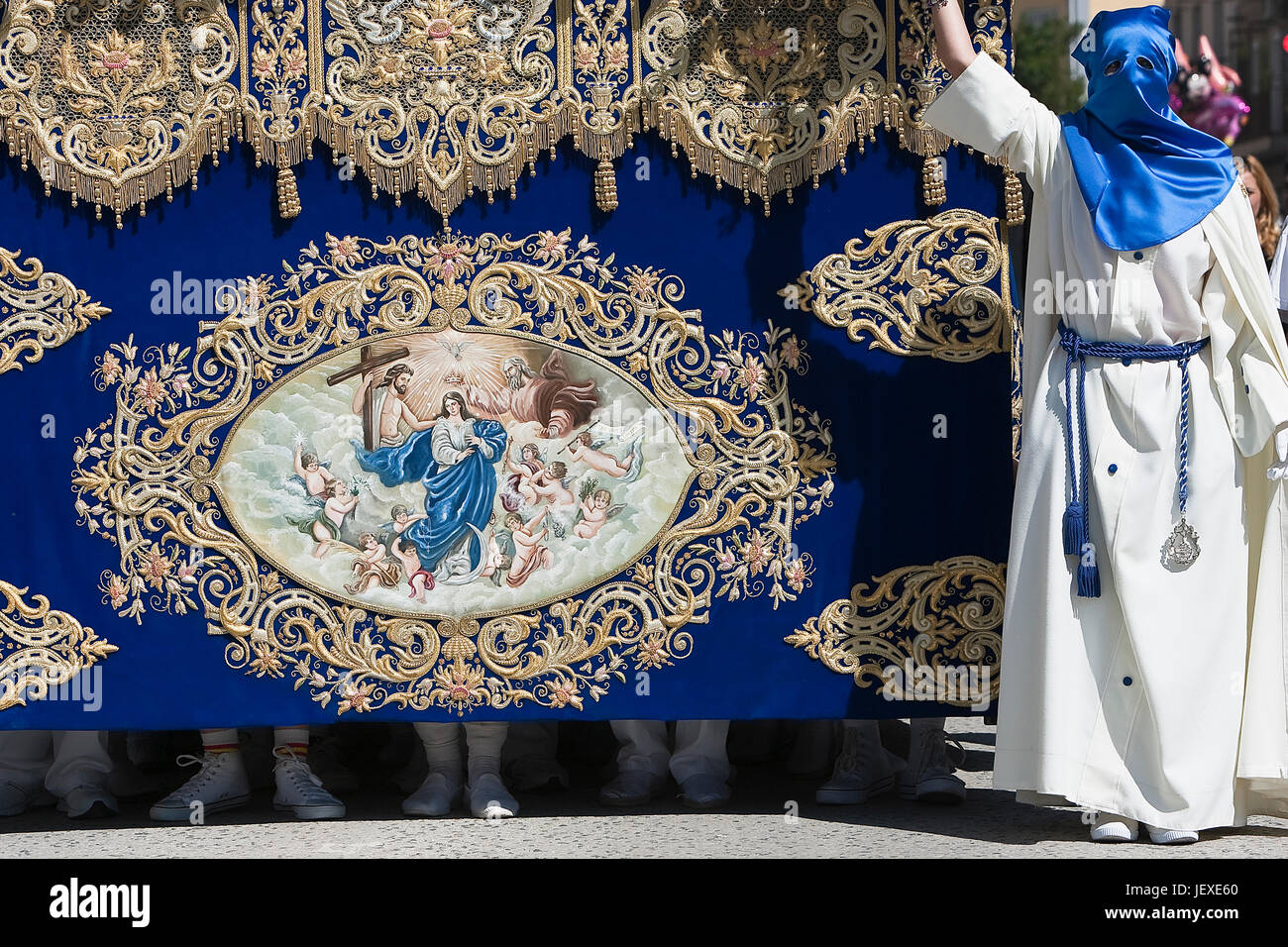 Throne of the Virgin Mary or called palio, embroidered in blue velvet with gold thread, biblical scene embedded on the front, procession of Holy Week, Stock Photo