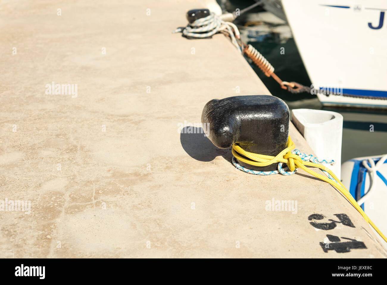 Mooring point where to dock the ships at harbor Stock Photo - Alamy