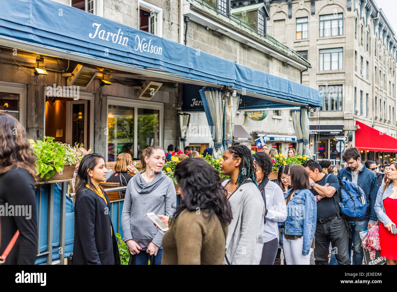 Montreal, Canada - May 27, 2017: Old town area Jacques Cartier square with people waiting in line queue outside restaurant called Jardin Nelson during Stock Photo