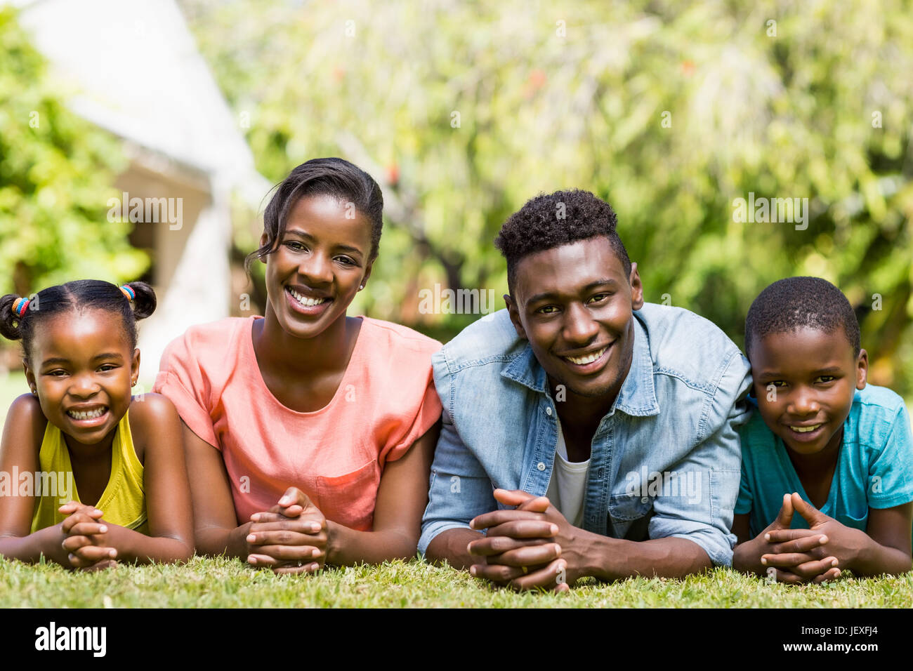 Happy family posing together Stock Photo - Alamy