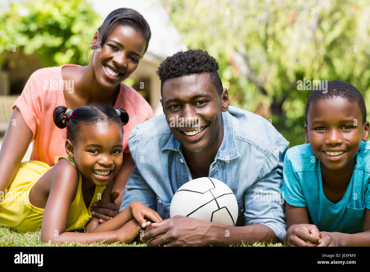 Happy family posing together Stock Photo - Alamy