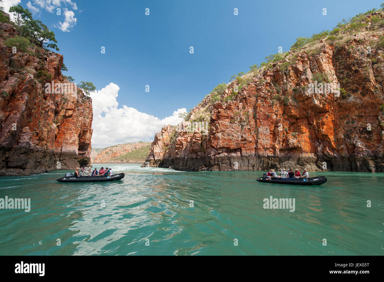 Tourists on zodiacs explore the extreme tidal fluctuations at Horizontal Waterfalls in Talbot Bay, Western Australia. Stock Photo