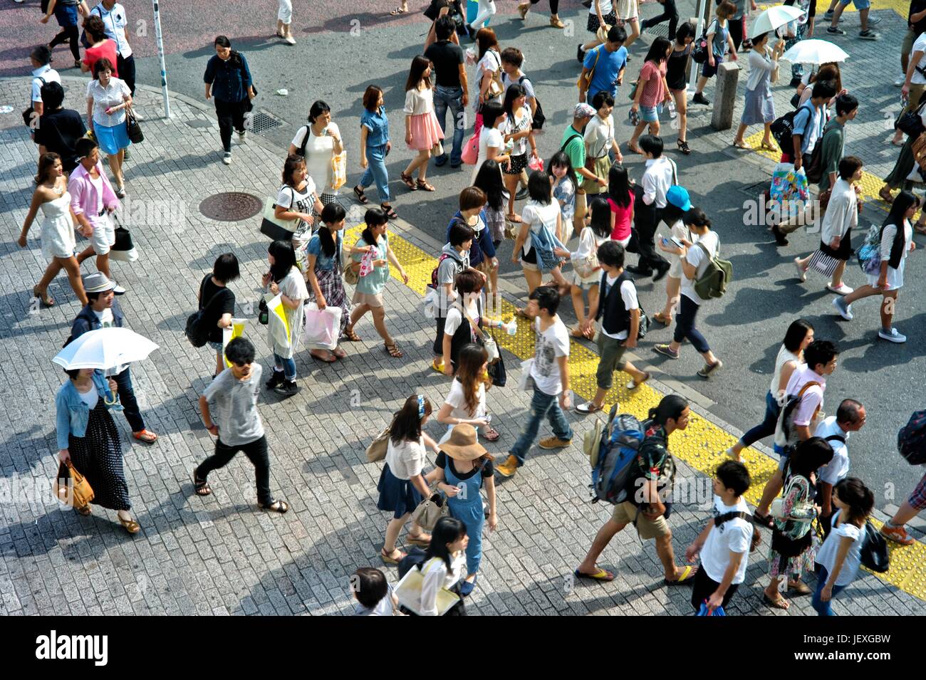 Pedestrians on the move in the Shinjuku District of Tokyo. Stock Photo