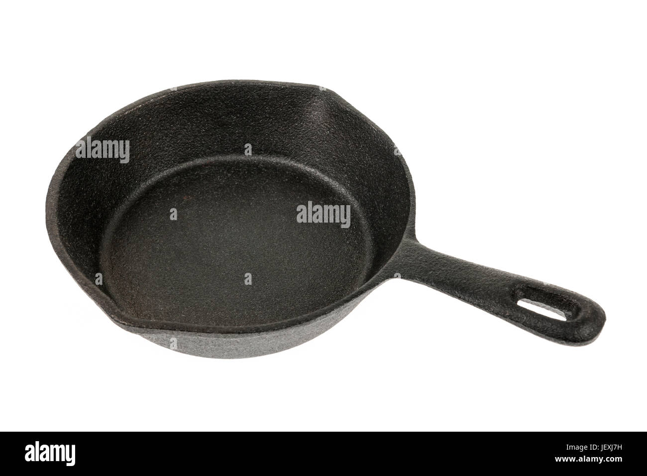 Cast iron black frying pan isolated on white background, side view Stock Photo