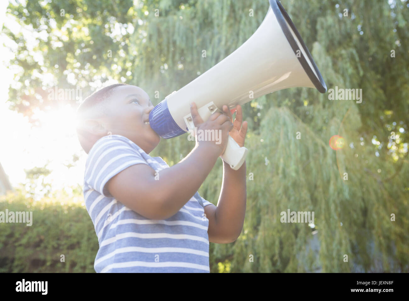 Boy using a megaphone Stock Photo - Alamy