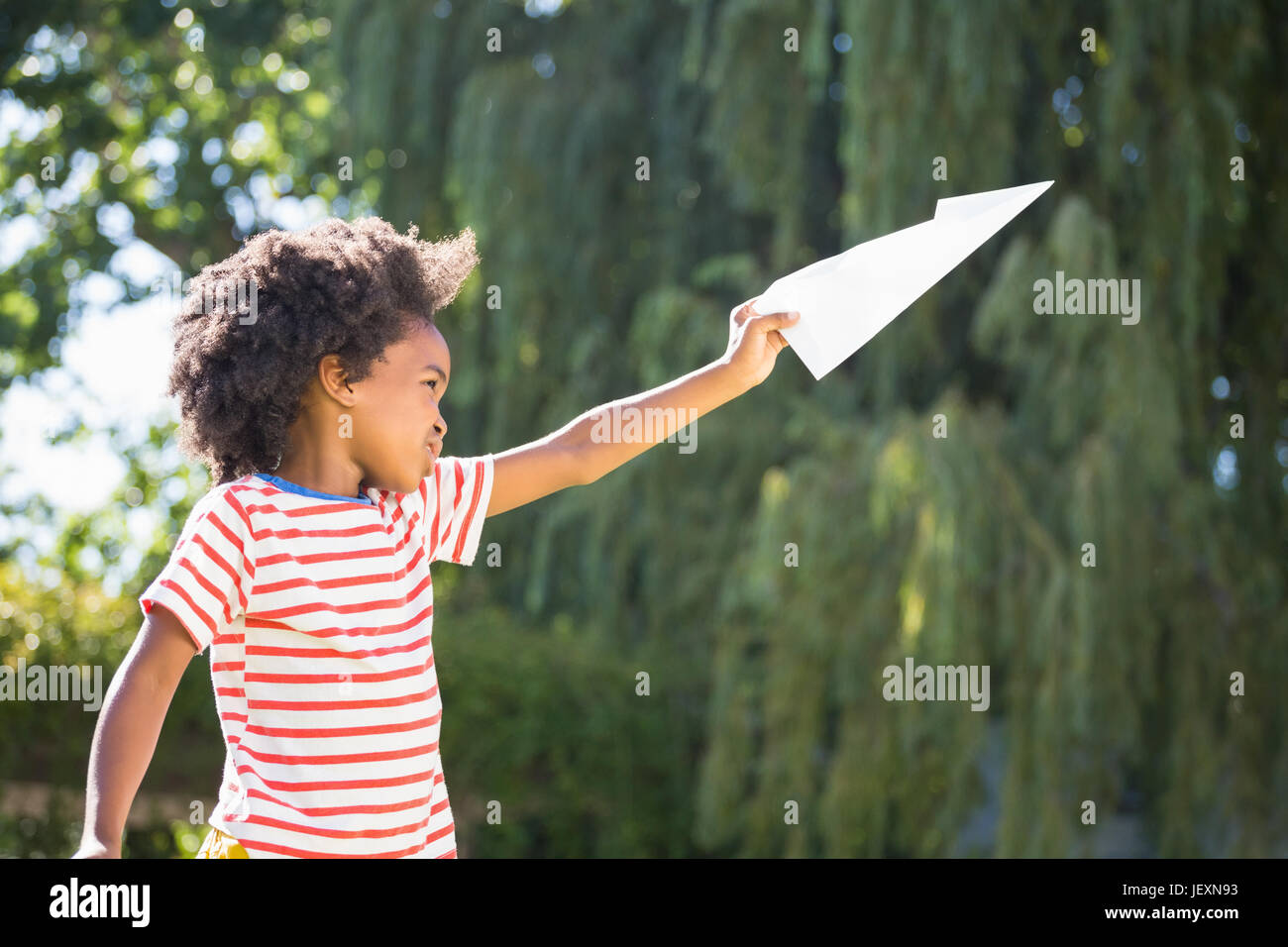 Boy flying paper airplane hi-res stock photography and images - Alamy