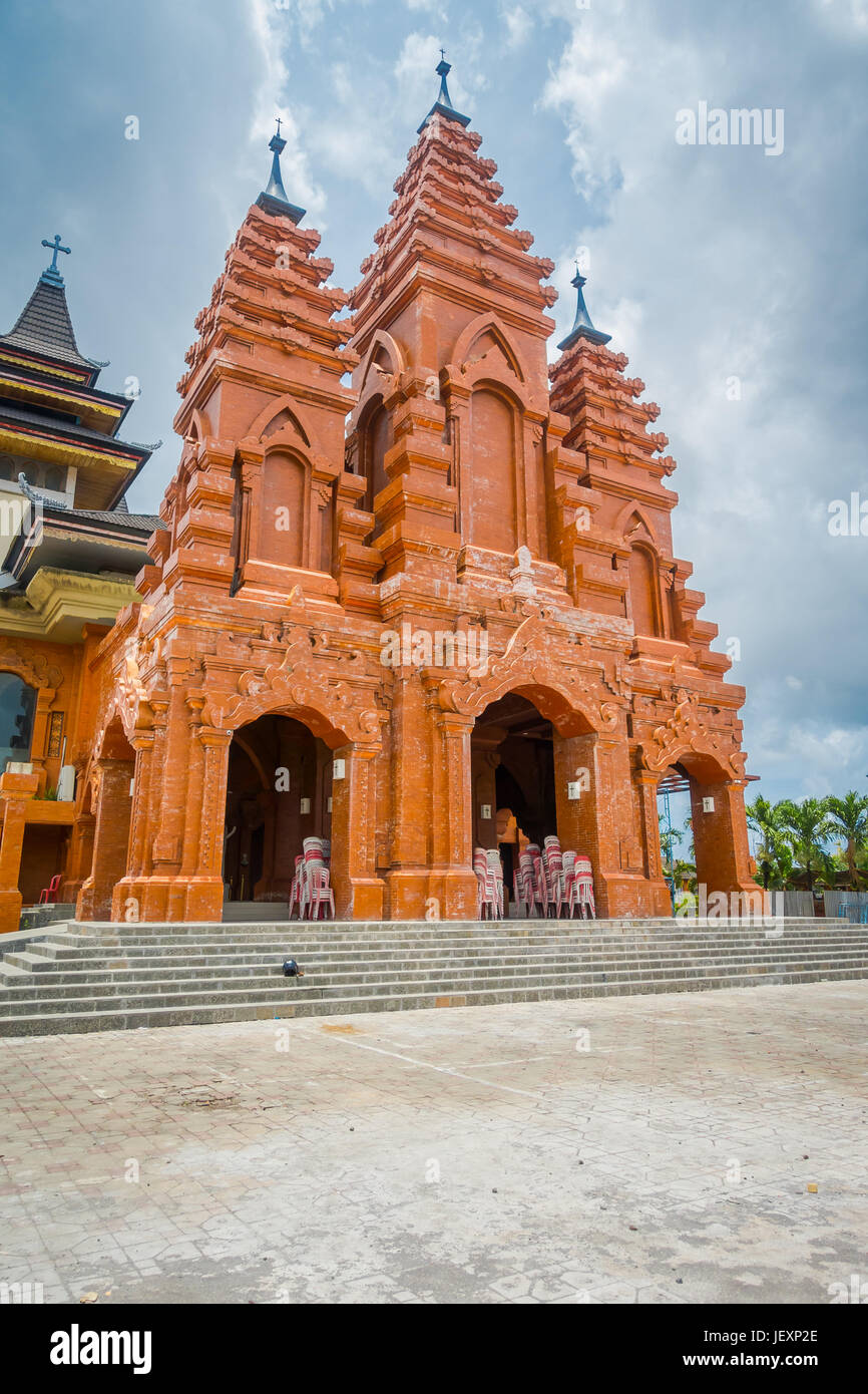 BALI, INDONESIA - MARCH 08, 2017: External view of the Katedral Roh Kudus, Catholic Church, located in Denpasar in Indonesia. Stock Photo