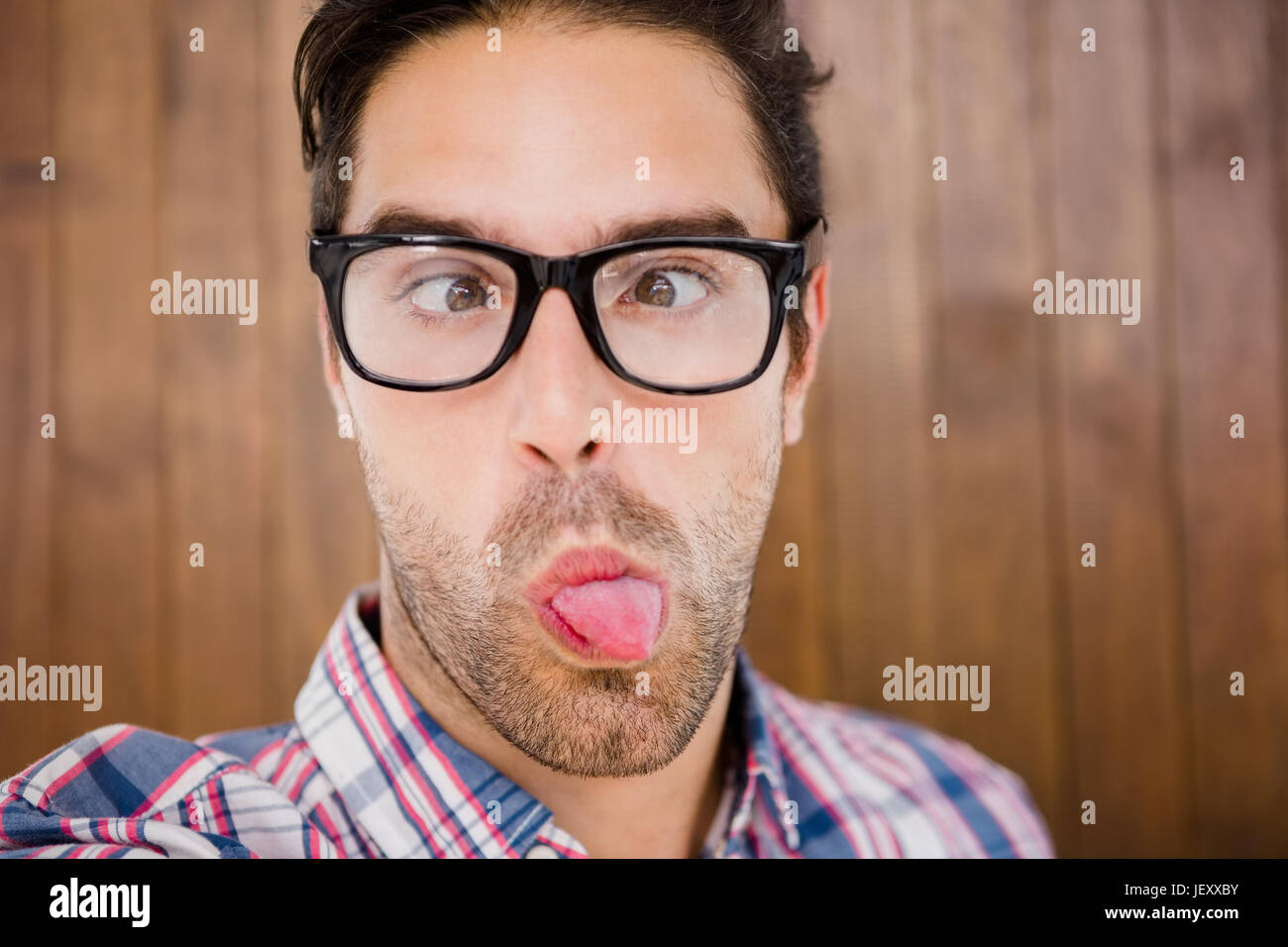 Young man pulling funny faces Stock Photo