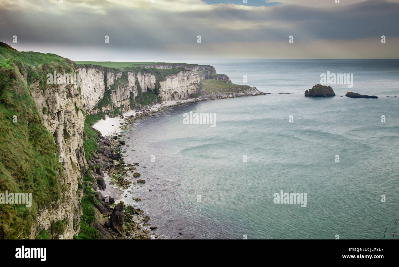 Near the tiny island of Carrickarede (from Irish: Carraig a' Ráid, meaning 'rock of the casting') in County Antrim near Ballintoy, Ireland Stock Photo