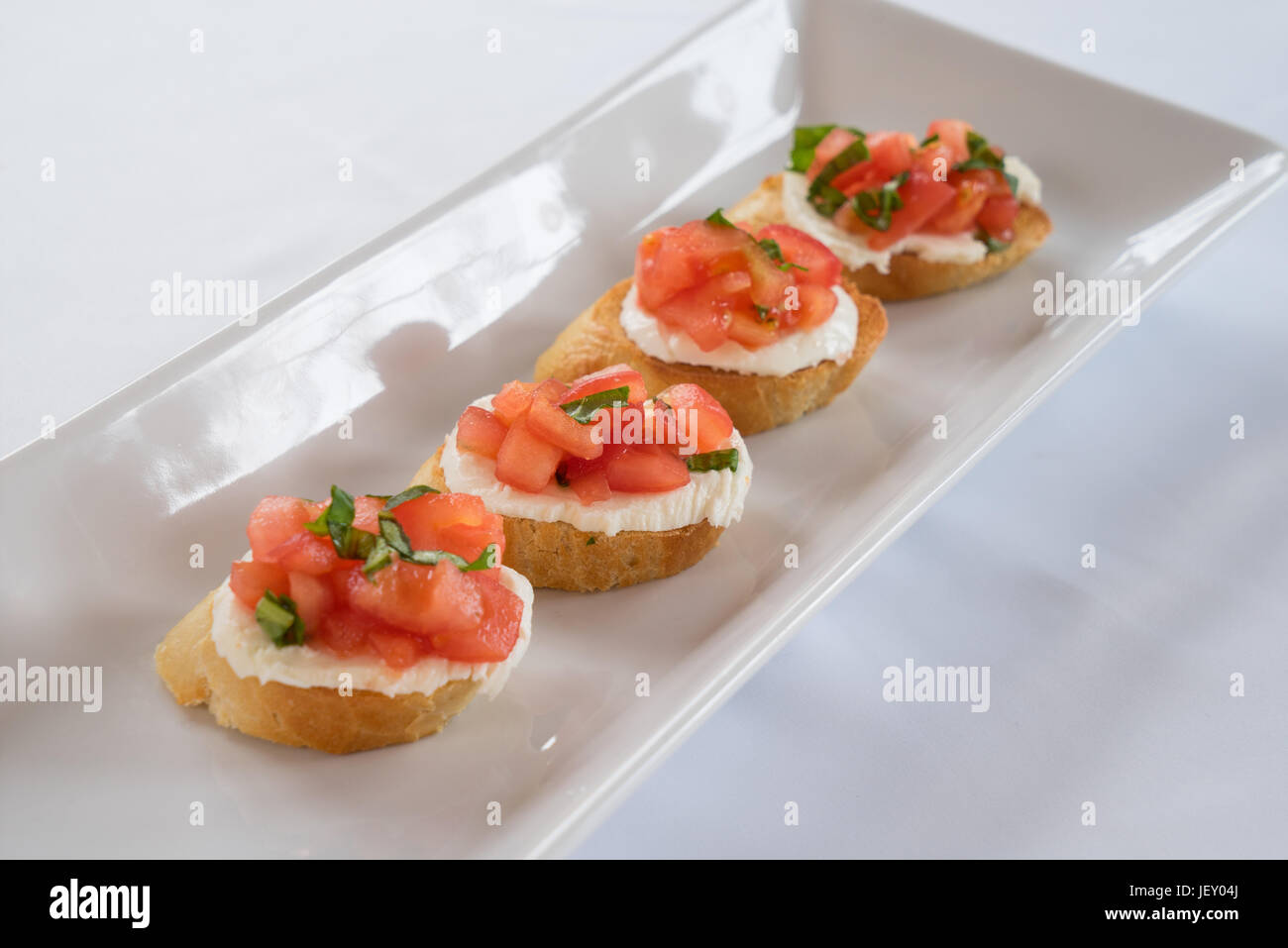 Tomato, basil & mozzarella bruschetta on toast Stock Photo