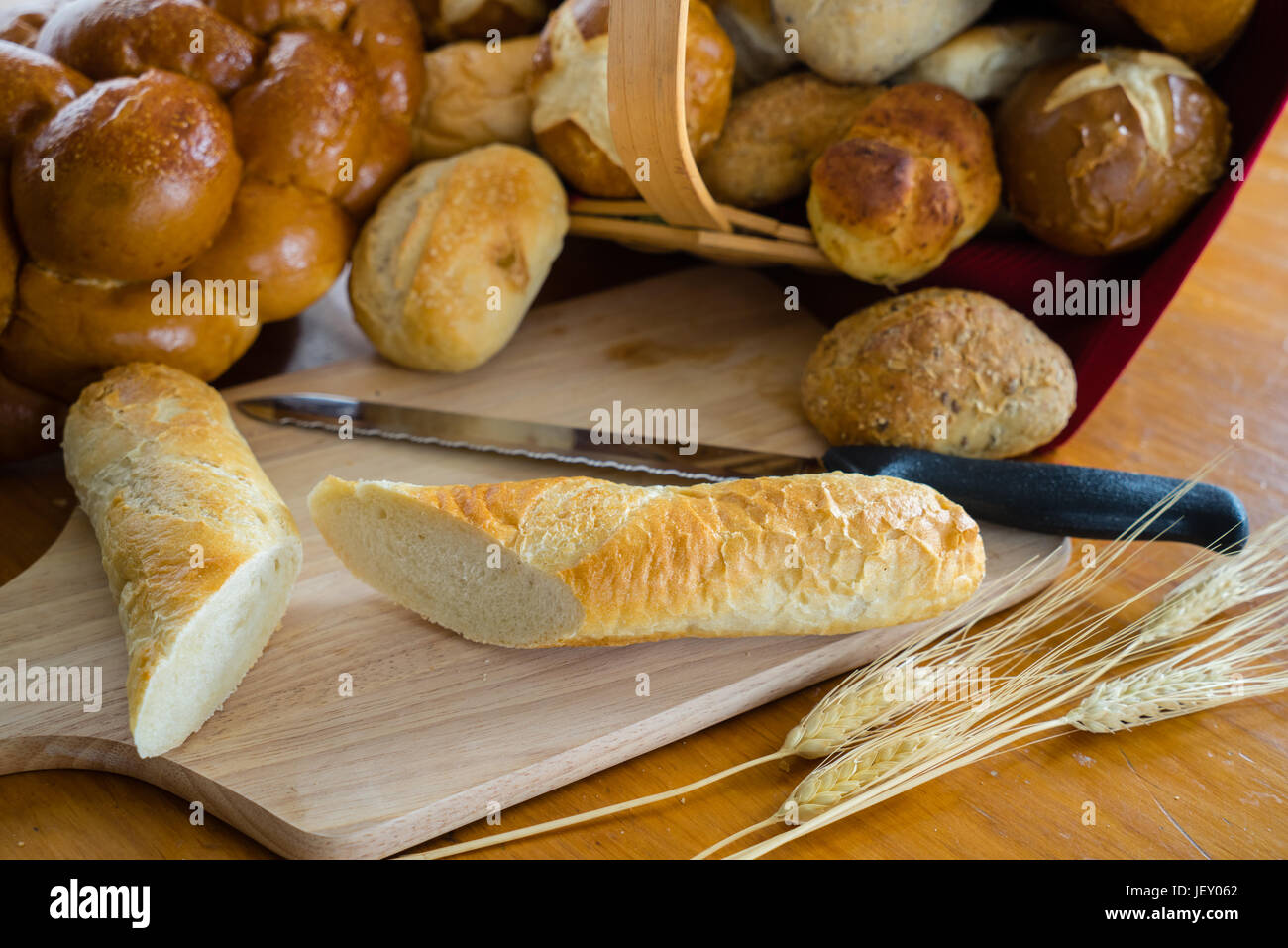 Collection of breads including Challah, baguettes and rolls Stock Photo