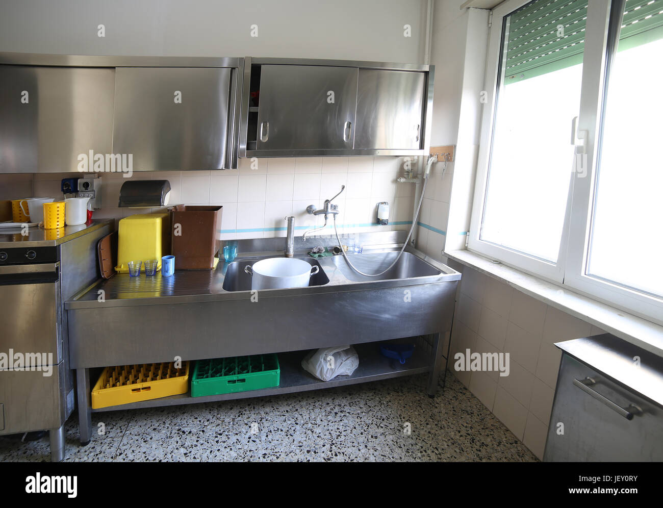 Large industrial sink of a restaurant for the washing of stainless
