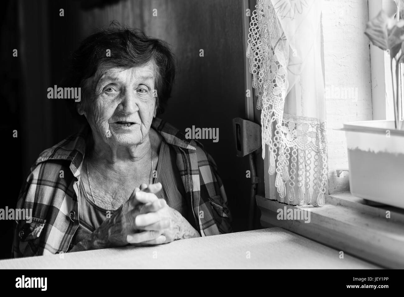 An elderly woman black and white portrait in a village house Stock ...