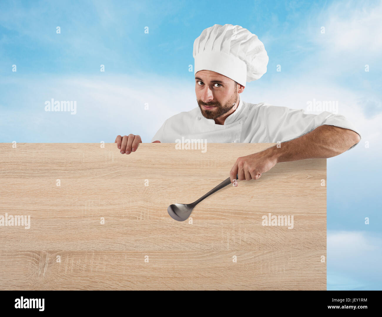 Chef with ladle and board Stock Photo