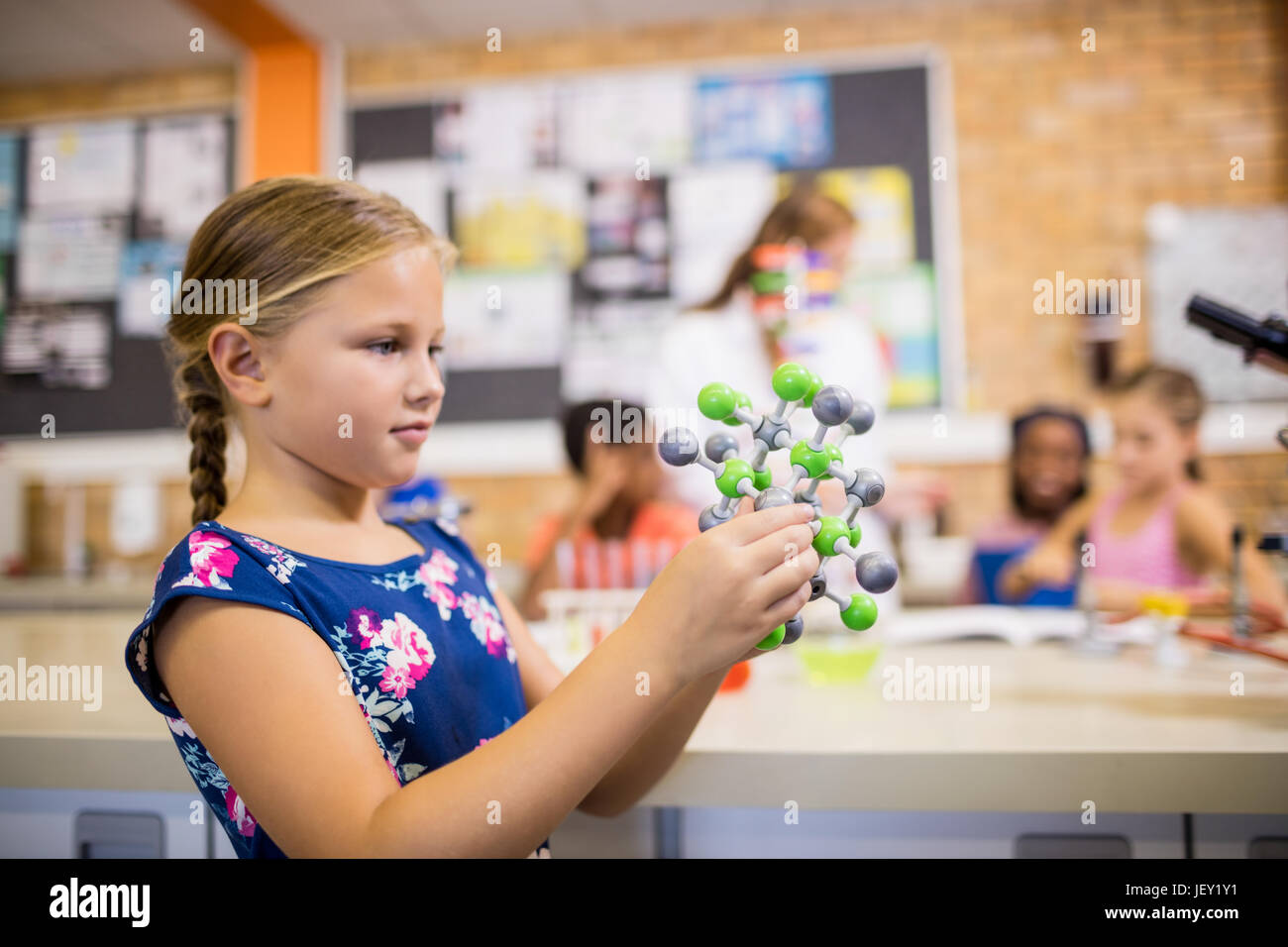 Child posing with an atom Stock Photo