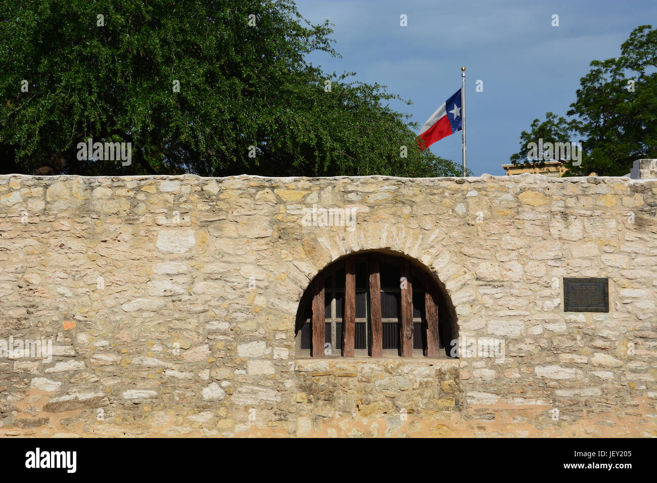 A window along the outer street wall at the Alamo in San Antonio. Stock Photo