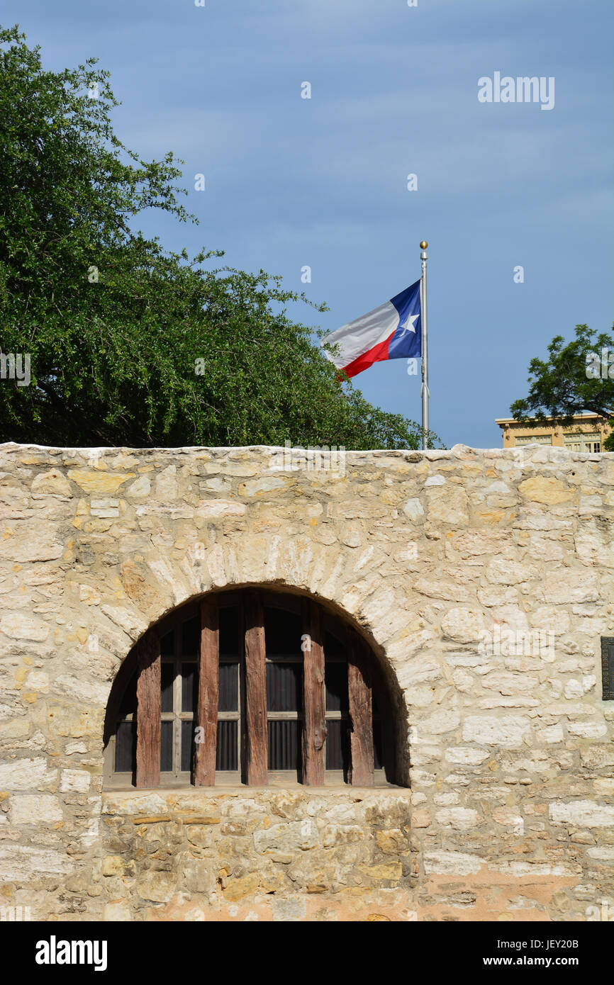 A window along the outer street wall at the Alamo in San Antonio. Stock Photo