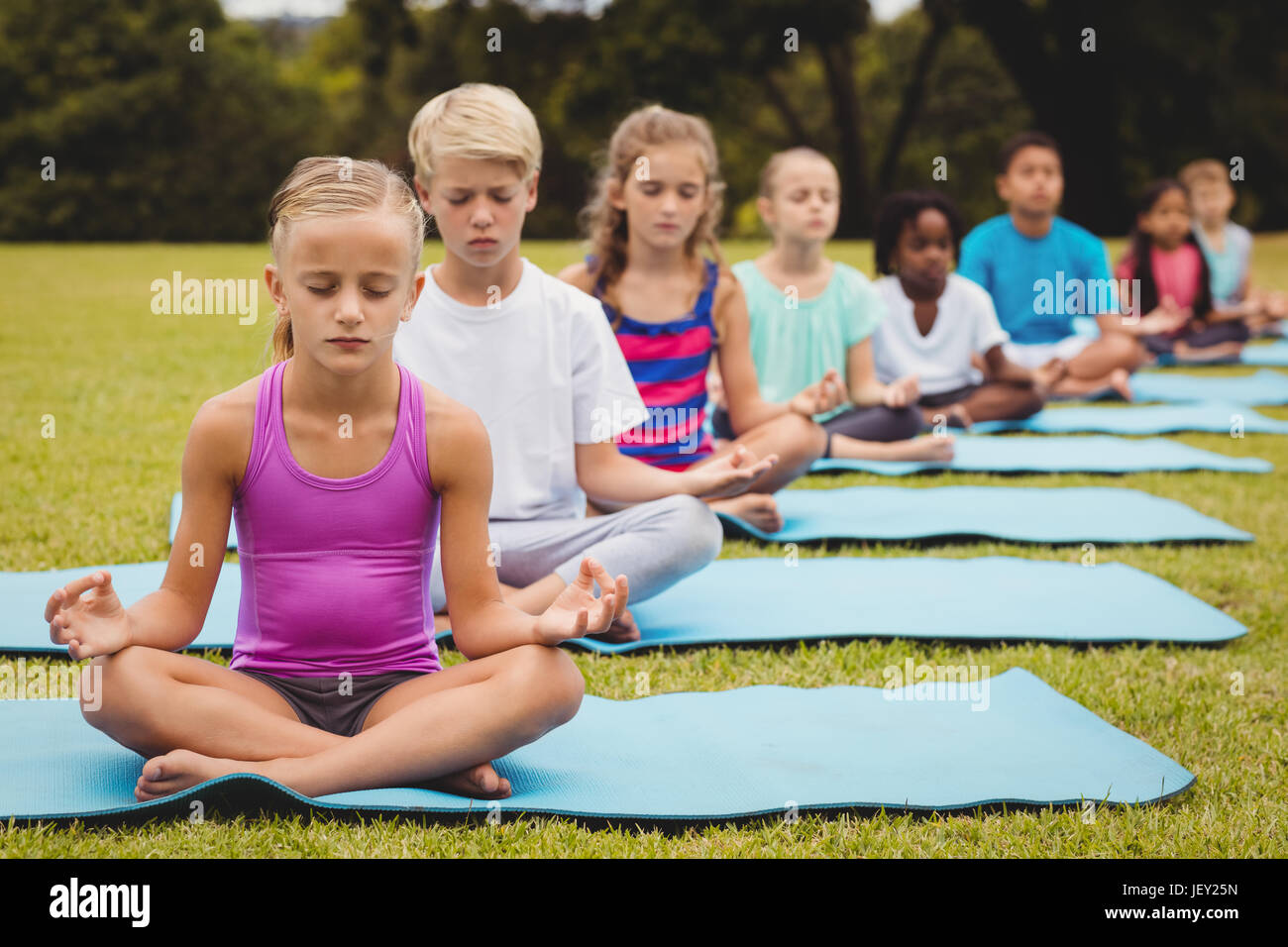 Group of children doing yoga Stock Photo - Alamy
