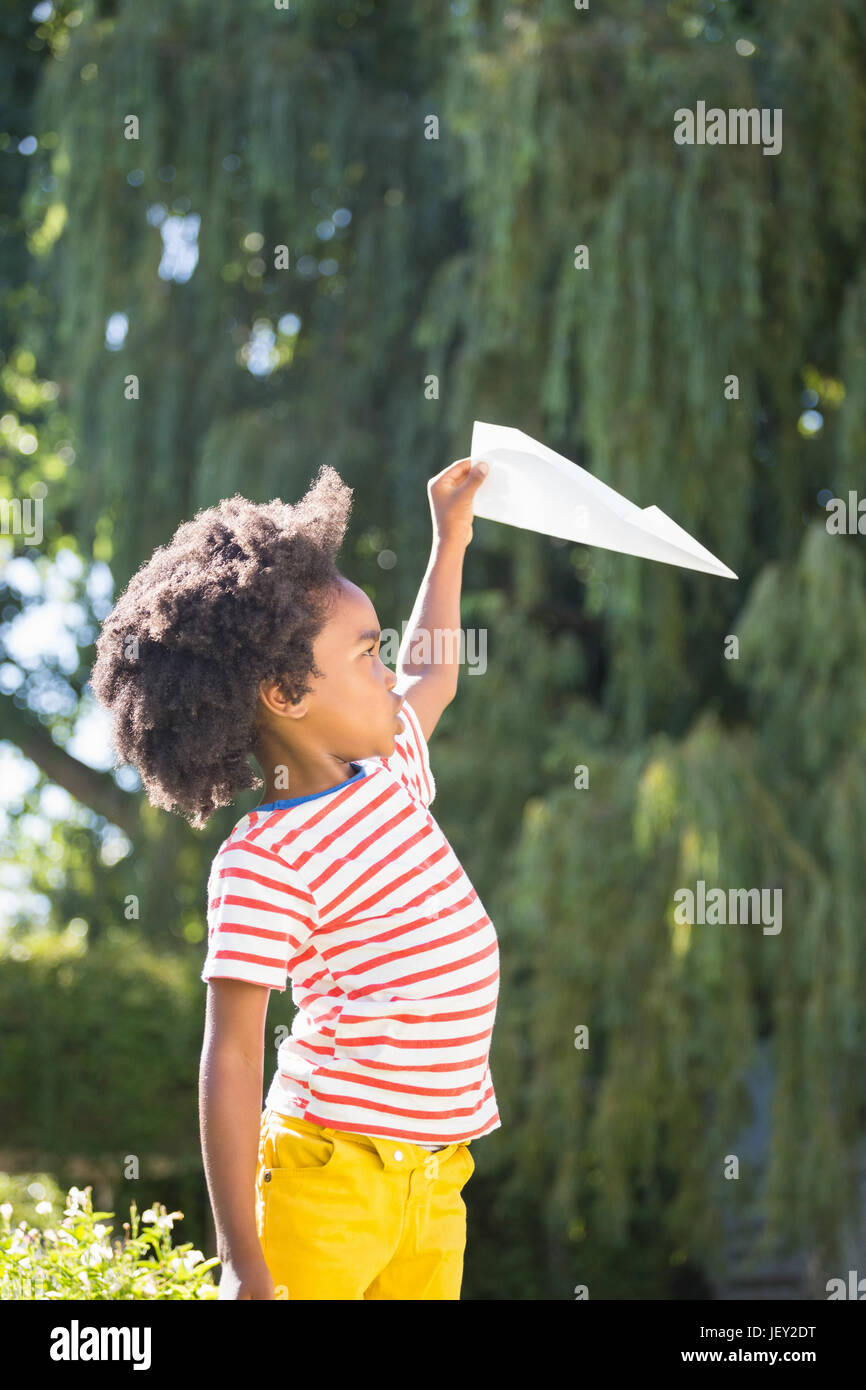 Boy flying paper airplane hi-res stock photography and images - Alamy