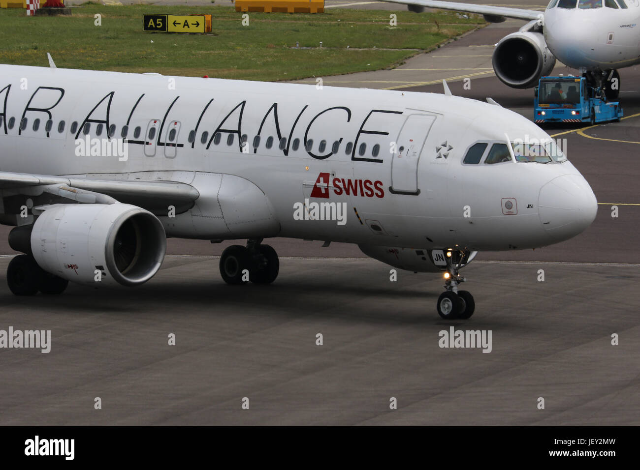 A Swiss Airlines Airbus A320 in the airlines Star Alliance special colour scheme taxis on to stand at Amsterdam Schiphol Airport Stock Photo