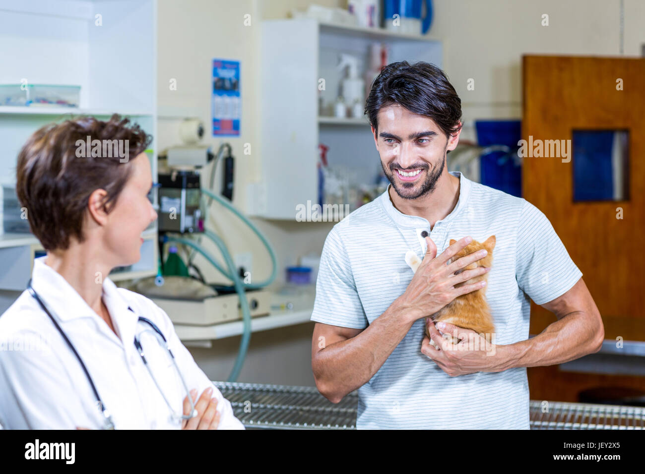 A woman vet looking her customer Stock Photo